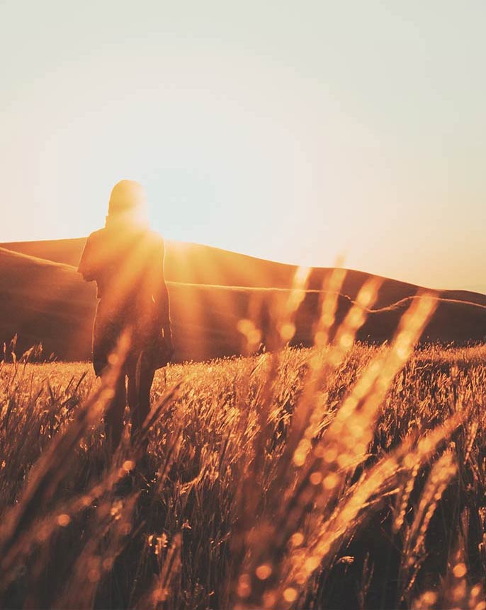 woman walking in field